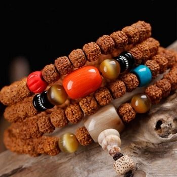 五瓣机刷大金刚菩提子佛珠手串搭配菩提根雕刻莲花虎眼石三通