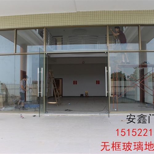高档无锡定户无框钢化玻璃门店面商拉地弹簧门平开推制无锡上奢华