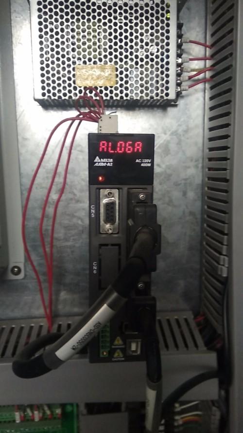 三菱m70钻工中心报警:伺服刀库异警 请问怎么回事