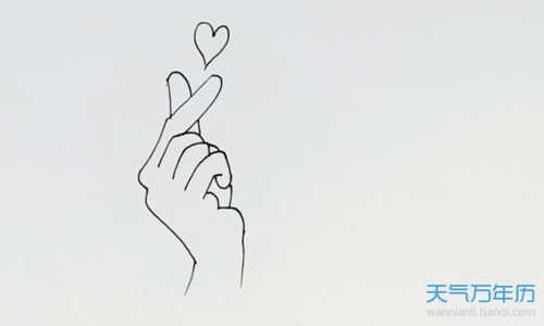 3,然后我们给爱心涂上红色,手涂上黄色就可以了.