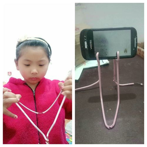 子涵利用废旧衣架做了个手机支架!