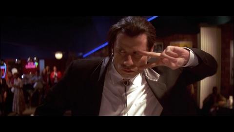 求低俗小说里文森特和蜜儿跳舞时候挂在脖子上的那个装饰叫什么名字.