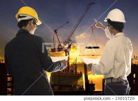 图库照片: two civil engineer working in building construction