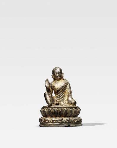 a silvered copper alloy figure of milarepa