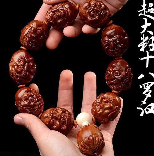 热销十八罗汉橄榄核手串 男款_大师核雕苏工纯手工雕刻印尼橄榄核手串