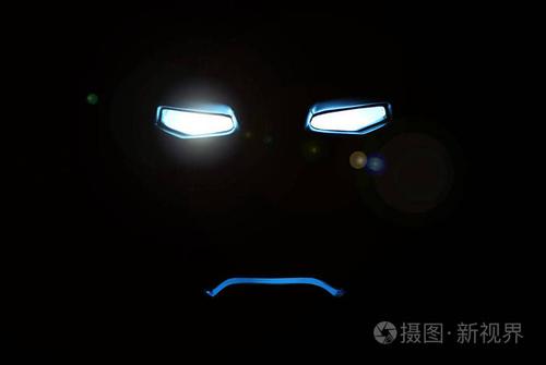 抽象的机器人亮眼睛在黑暗中