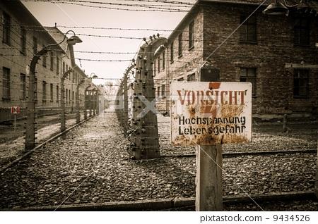图库照片: electric fence in former nazi concentration camp
