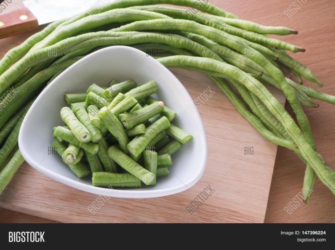 sliced yard long bean vegetable on the white dish