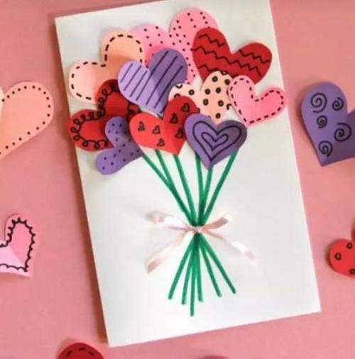 5,将花杆上粘贴好爱心花朵,在进行整体装饰,一张贺卡就制作完成了.