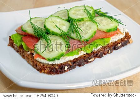 sandwich with cucumber dill salad and cream cheese on rye bread