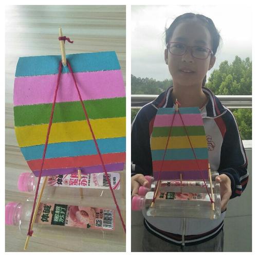 这是孟优璇用饮料瓶,旧筷子,硬卡纸做成的小帆船,多么逼真呀!