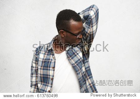 disgusted young male wearing checkered shirt and