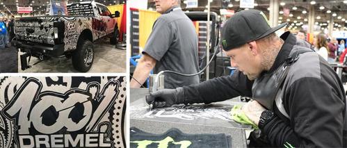 hank robinson uses a dremel engraving tool to carve his custom