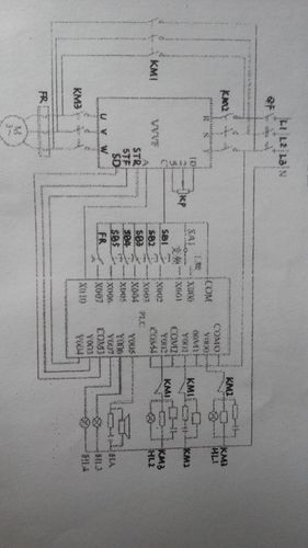 根据下面的电气原理图及plc梯形图写出该系统的控制原理及各个开关或