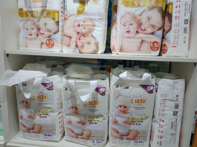 宜婴纸尿裤买四送一  ,买一件立减100元  扭扭车
