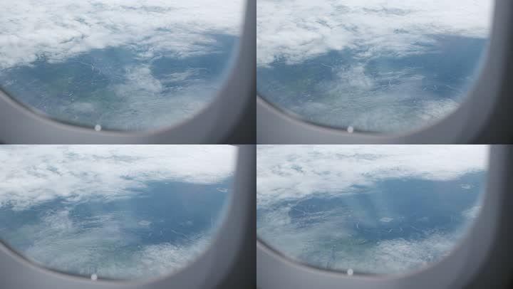 阴天透过飞机窗户的蓝天_3840x2160_高清视频素材下载