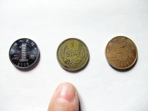 铜铸1毛硬币疑是错版 真身是纪念币鼻祖"长城币"
