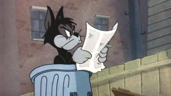 猫和老鼠:黑猫在垃圾桶里面,翻出一张报纸,对着报纸亲吻着