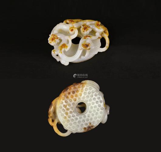 明代 白玉红皮谷纹螭虎璧