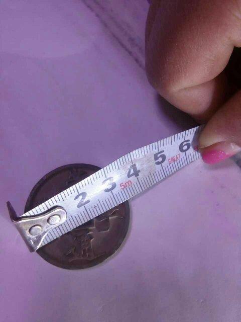 5厘米,厚度3毫米,背面无字,方孔前后有一定的倾斜.市场价多少?