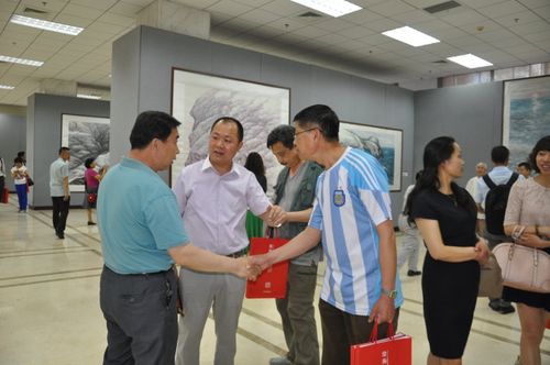 左起刘海洋师长,聊城宣传部赵昌军副部长,聊城市书协驻会张鸿达副