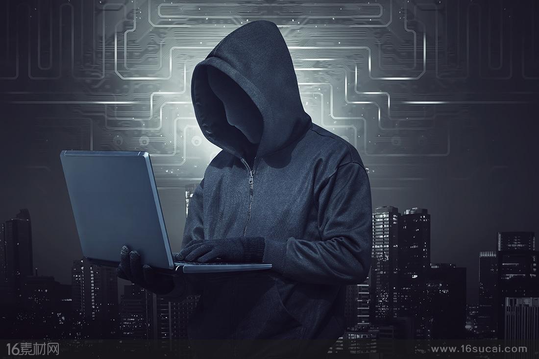 灰色科技线条城市背景上操作电脑的黑客高清图片