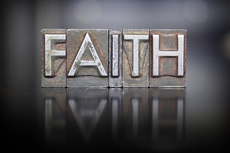 the word faith written in vintage letterpress type