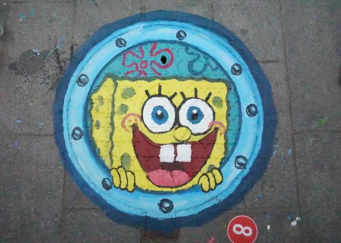 我校学生会举行井盖涂鸦活动