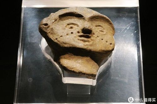 双墩遗址出土的纹面泥塑人头像:说明双墩文明已经出现了纹面习俗.