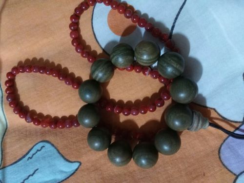 绿檀手串用手能盘出包浆吗?每天盘多久?