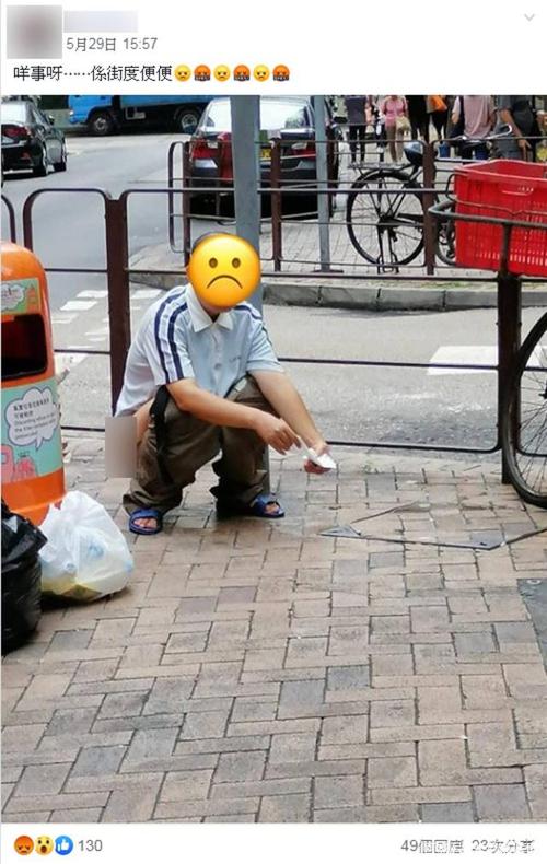 一名男子于路口公然大便