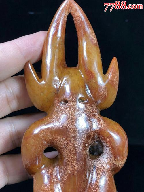 出土红山文化时期黄山玉太阳神,其构思巧妙,比例适当