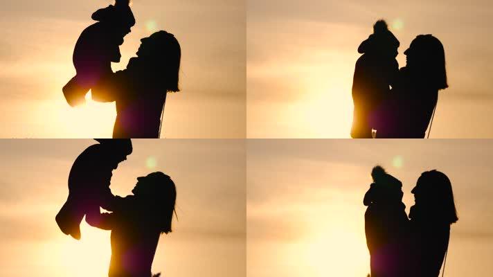 妈妈抱起孩子母爱剪影视频素材