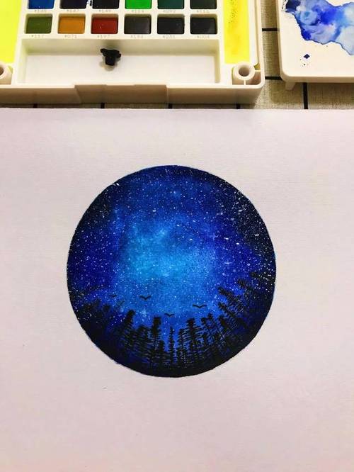 第六步:用牙刷沾白颜料,喷洒在画面上,形成星星