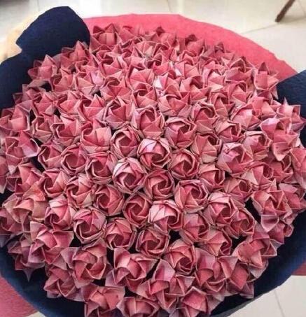 100人民币折纸花教程