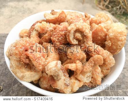 crisped pork fat left after being fried for lard ready to eat as