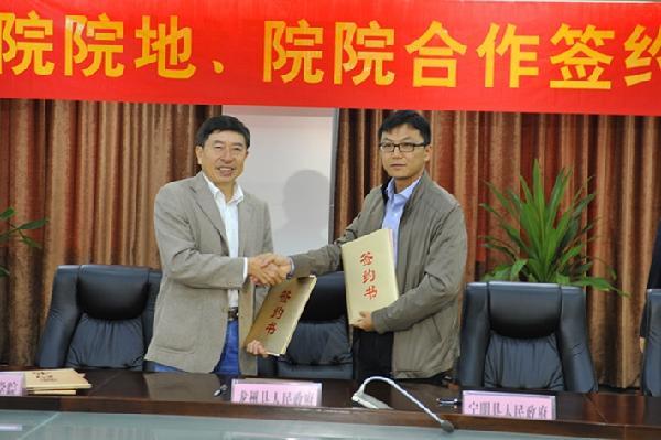 图为县委常委,宣传部部长,副县长徐毅代表宁明县签约图为签约仪式现场