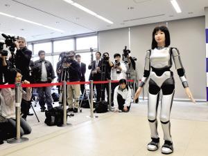 科学探索 > 正文    日本研究人员16日向媒体展示一个类人机器人.