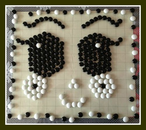 这张是女儿用五子棋拼的.