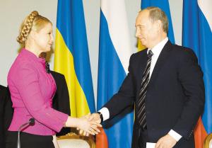 普京(右)和季莫申科握手言和.