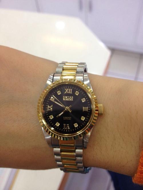 swiss marine 这个表是真得吗?别人送得,多少钱