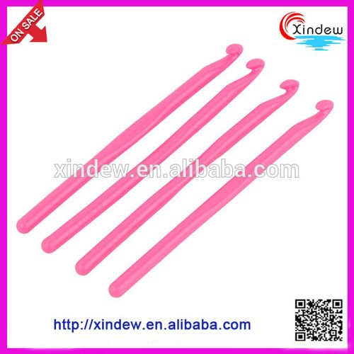pink plastic crochet hook, knitting needle