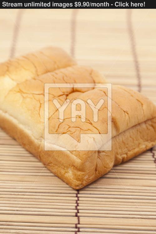 loaf of bread on wooden plate