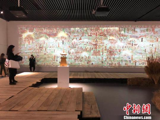 "觉色敦煌"在上海揭幕 3000平方米黄沙还原敦煌实景