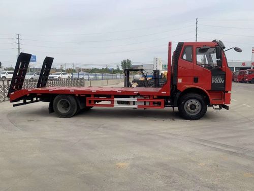 解放j6黄牌平板车拉150挖机