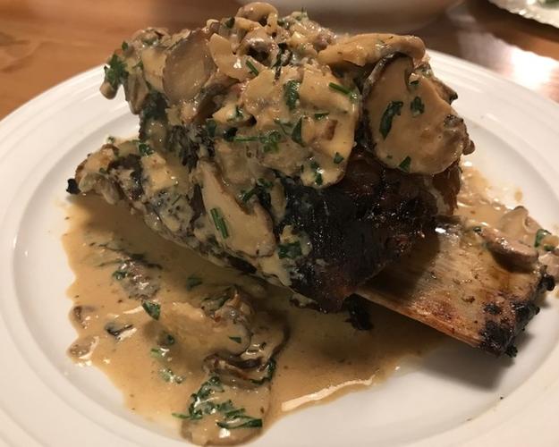 slow grilled beef short rib steak with sauce diane