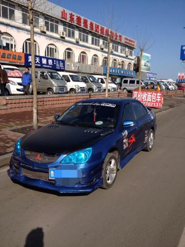 在北京v3菱悦装尾翼验车能过吗?我买的时候出场不带,可是我看.