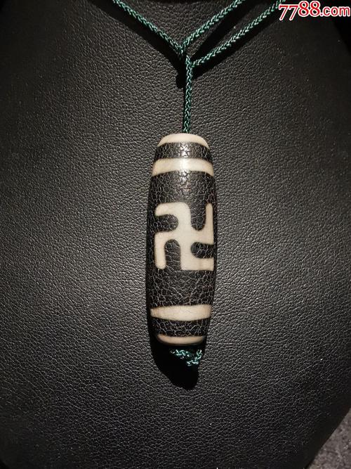 佛教万字符卍图案玛瑙天珠,图案线条清晰,表面有橘皮纹,详见细图,天珠