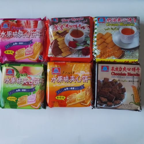 热卖香橙味夹心饼干207g 华声橘子早餐点心牛奶伴侣水果夹心 12袋包邮