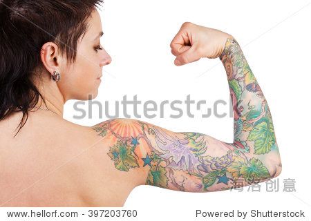 dark-haired woman with a tattoo showing biceps